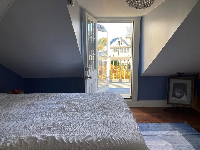 a view of an empty room and a window