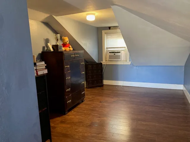a view of a hallway with entryway wooden floor and hall