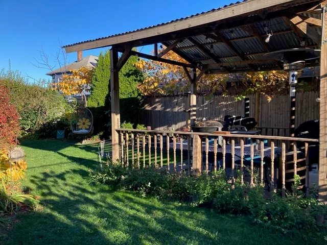 a view of a deck with a big yard