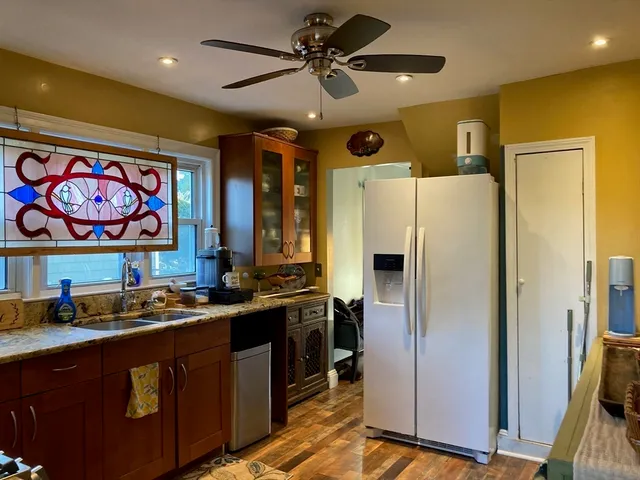 a kitchen with stainless steel appliances a refrigerator and a sink