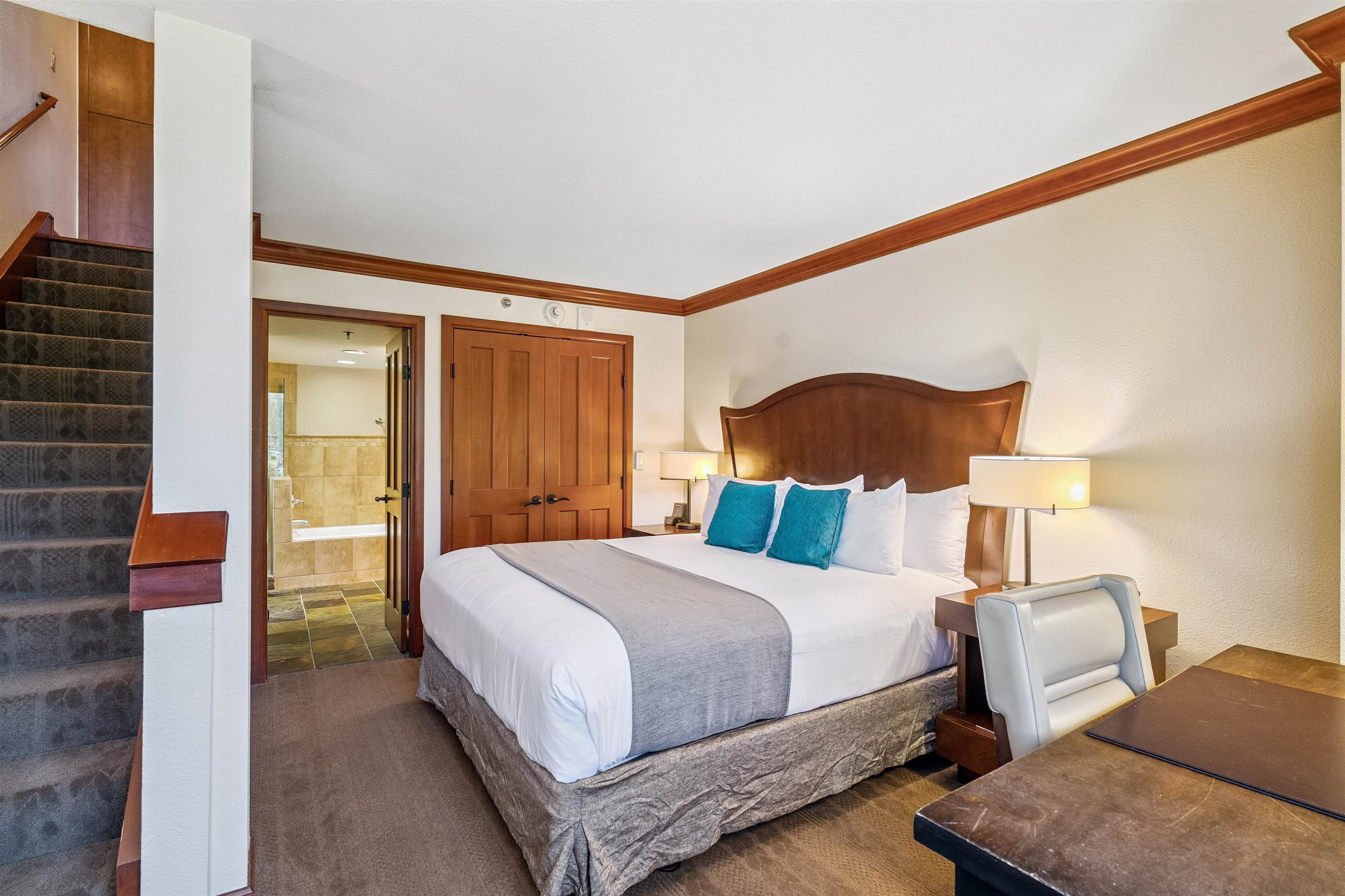 400 Resort Road, Unit 932 Olympic Valley, CA 96146 - Photo 11 of 24 a bedroom with a bed and lamp with the outer view