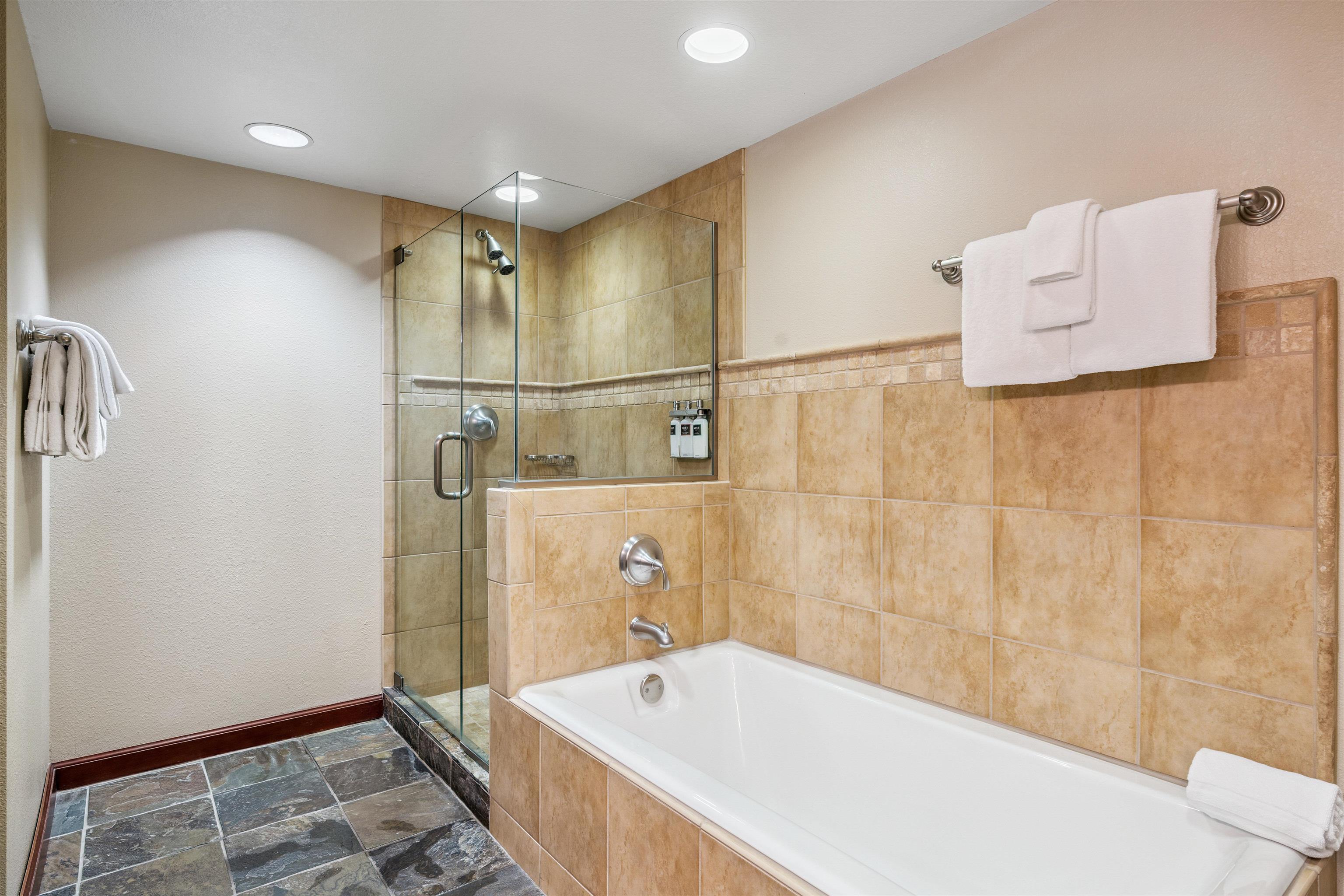 400 Resort Road, Unit 932 Olympic Valley, CA 96146 - Photo 13 of 24 a bathroom with a bathtub and a shower