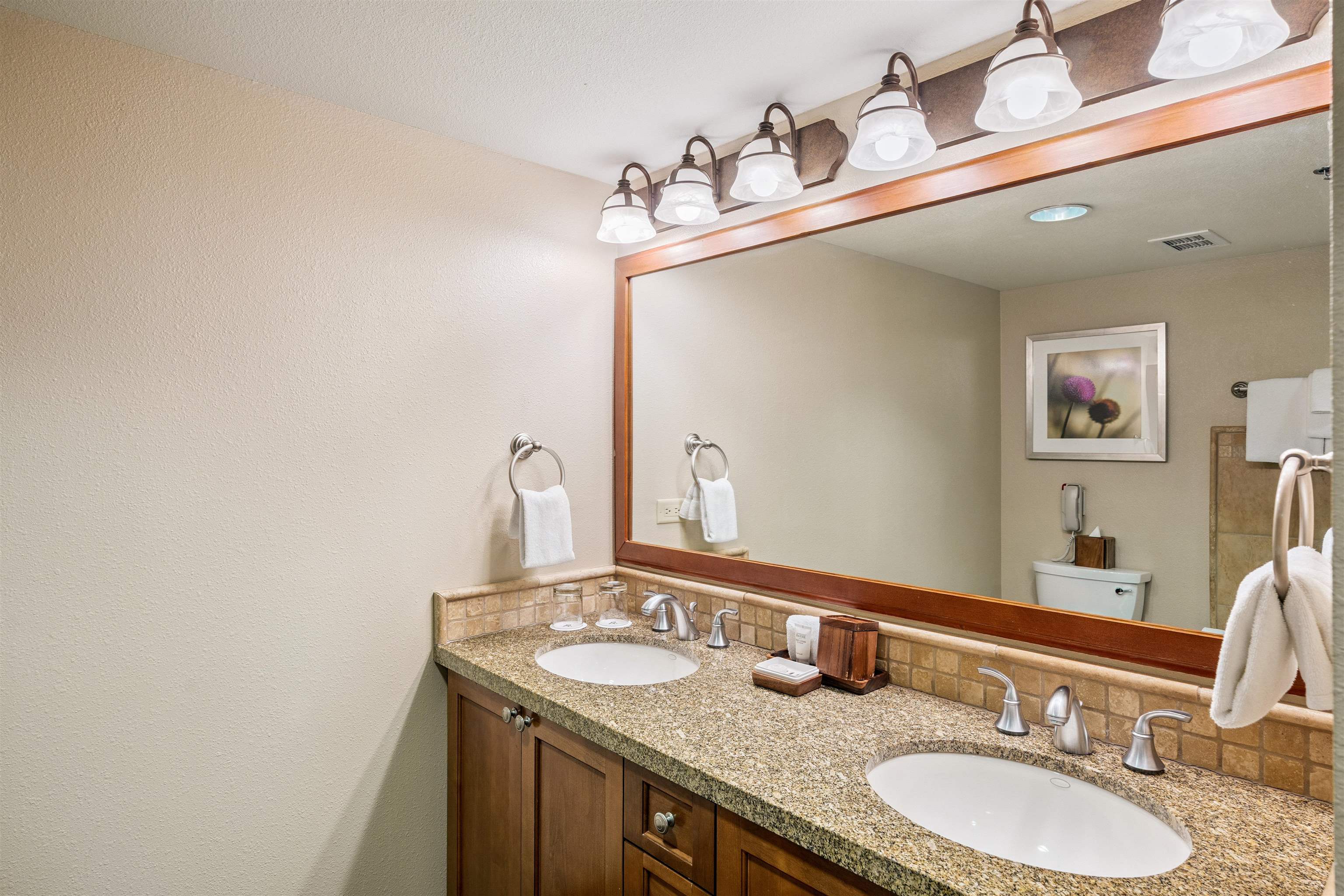 400 Resort Road, Unit 932 Olympic Valley, CA 96146 - Photo 14 of 24 a bathroom with a granite countertop sink a large mirror and a