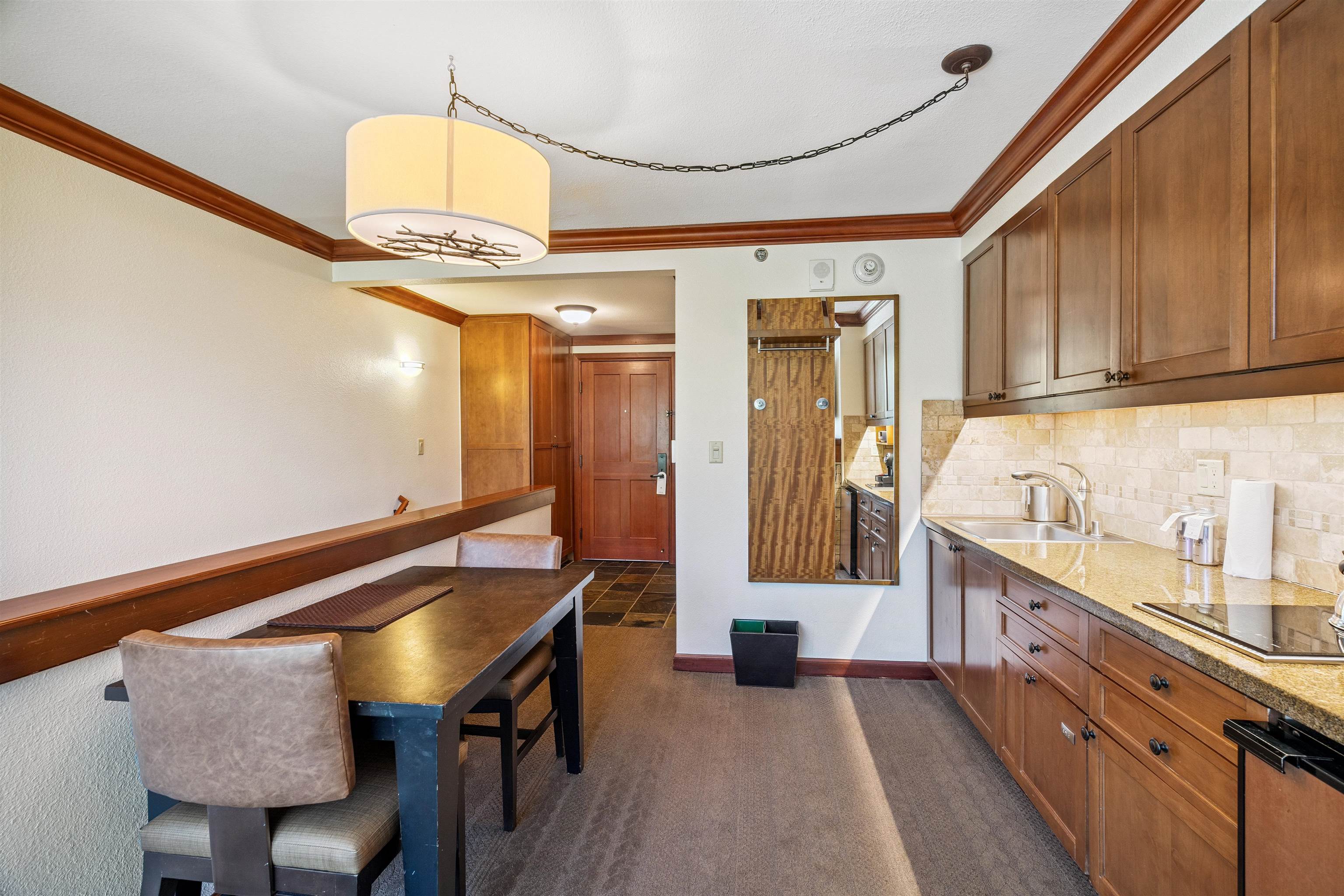 400 Resort Road, Unit 932 Olympic Valley, CA 96146 - Photo 7 of 24 a kitchen with granite countertop a sink and cabinets