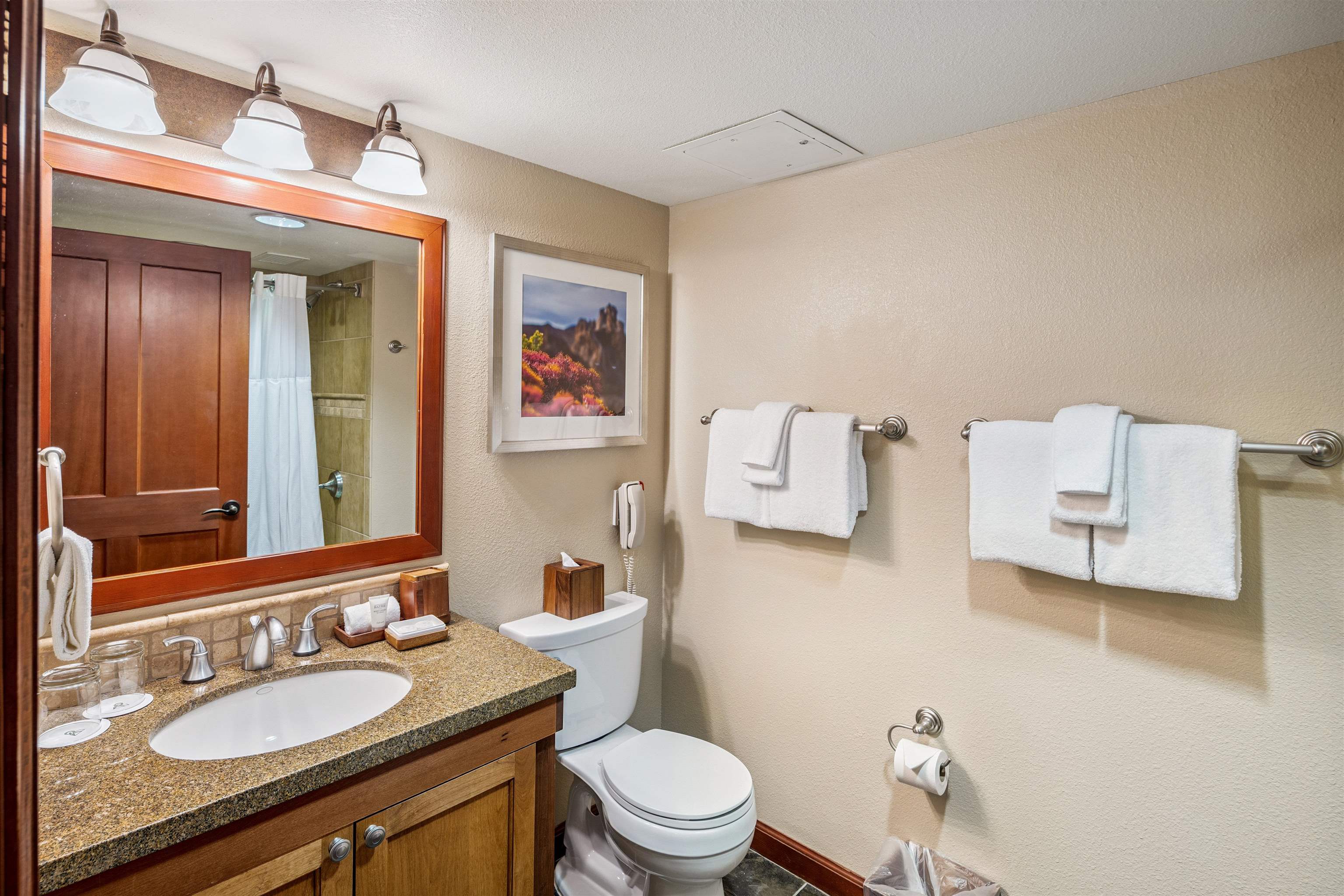 400 Resort Road, Unit 932 Olympic Valley, CA 96146 - Photo 8 of 24 a bathroom with a granite countertop sink mirror vanity and toilet