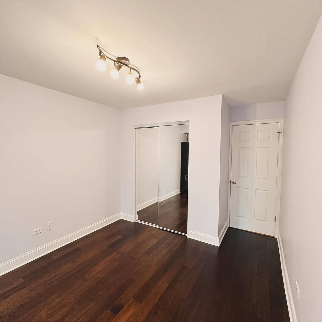 1575 Sandpebble Drive, Unit 104 Wheeling, IL 60090 - Photo 8 of 8 a view of a room with wooden floor