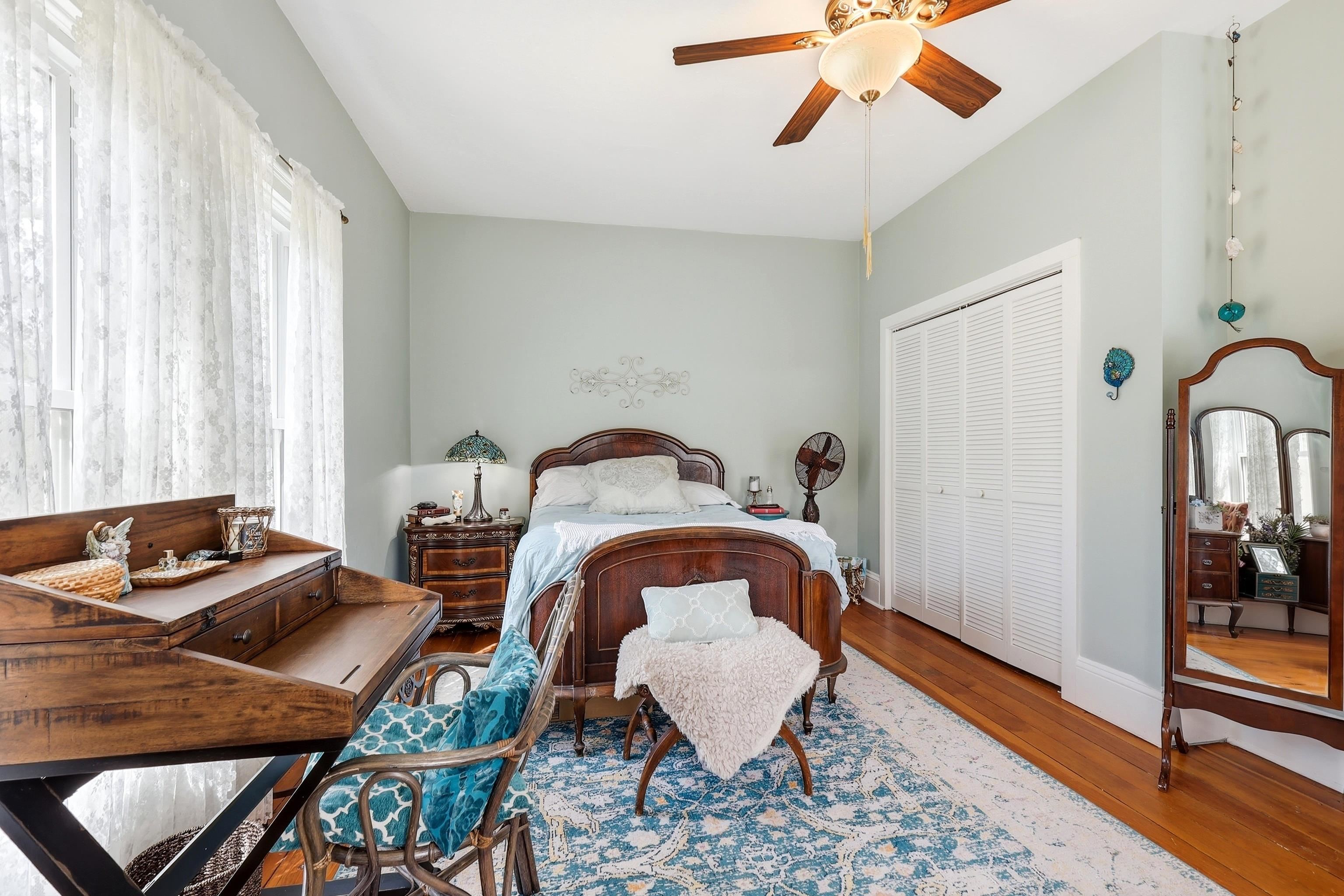 2562 West Blackjack Road Galena, IL 61036 - Photo 42 of 75 a bedroom with a bed and a chandelier