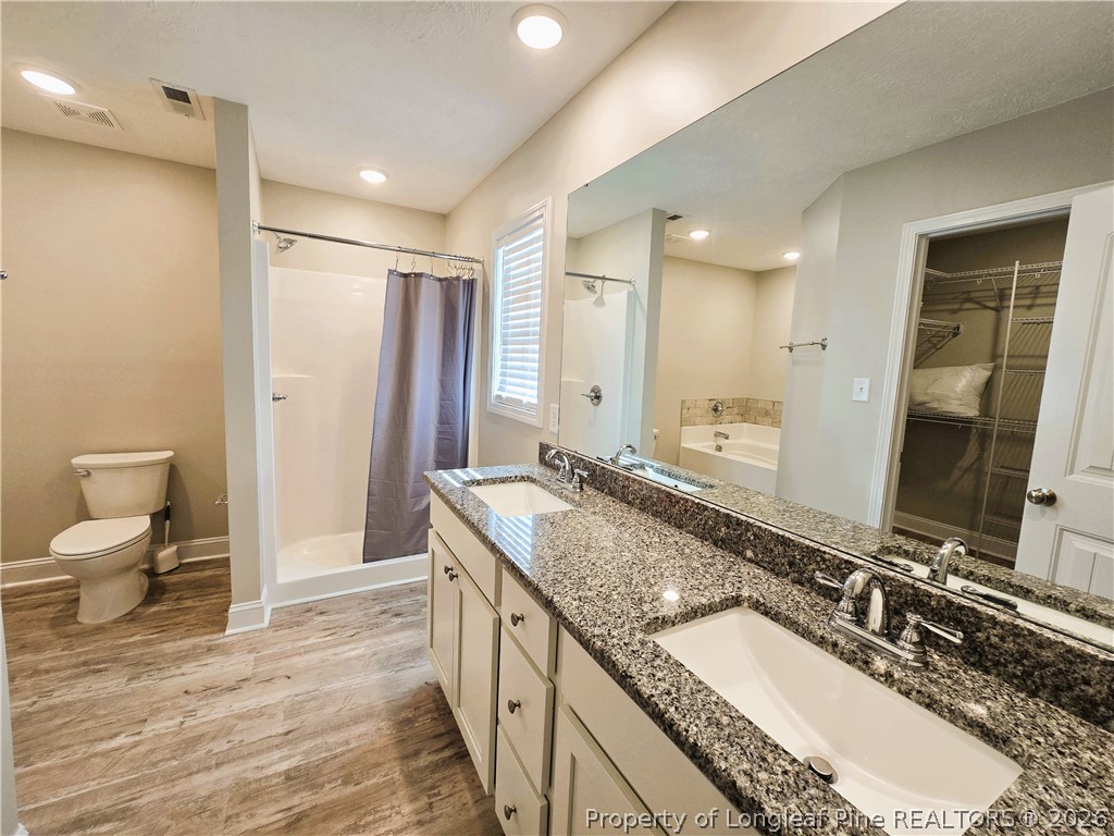422 Mitchell Farm Road Goldsboro, NC 27530 - Photo 24 of 28 a bathroom with a granite countertop double vanity sink and a mirror