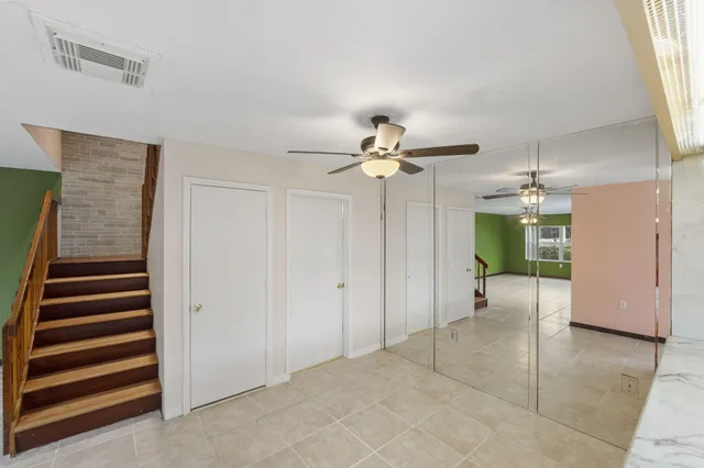 a view of bathroom with a toilet sink and mirror