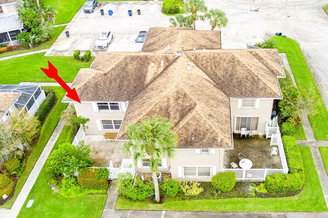 an aerial view of a house with an outdoor space