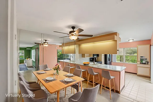 a kitchen with granite countertop a sink and a refrigerator