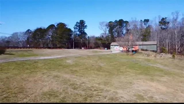 a view of a playground with lots of green space and deers