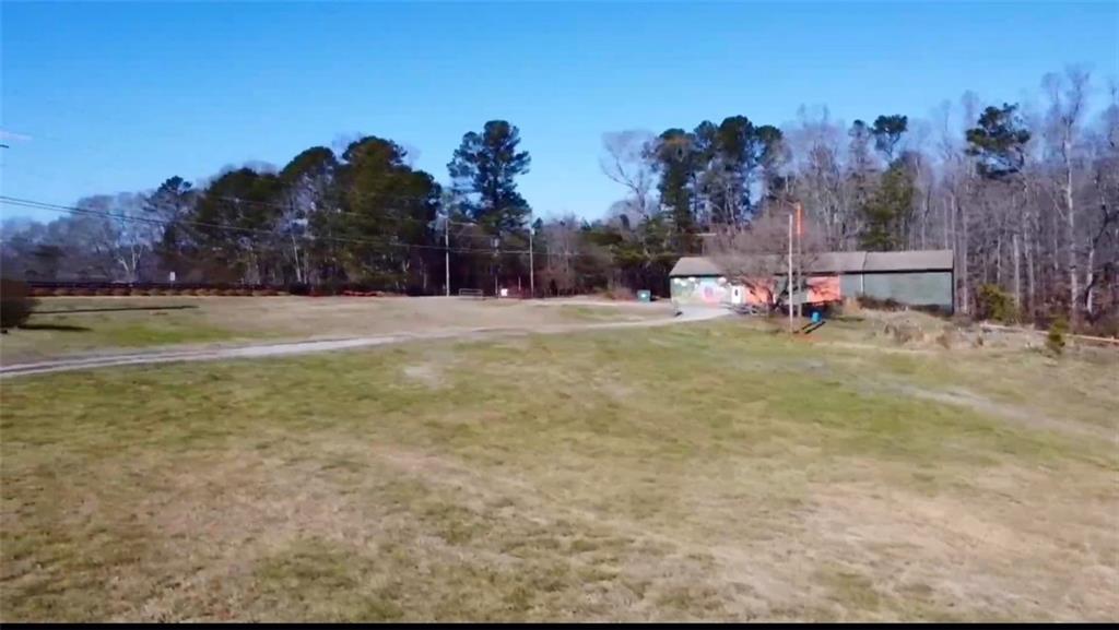 834 Arnold Mill Road Woodstock, GA 30188 - Photo 3 of 10 a view of a playground with lots of green space and deers