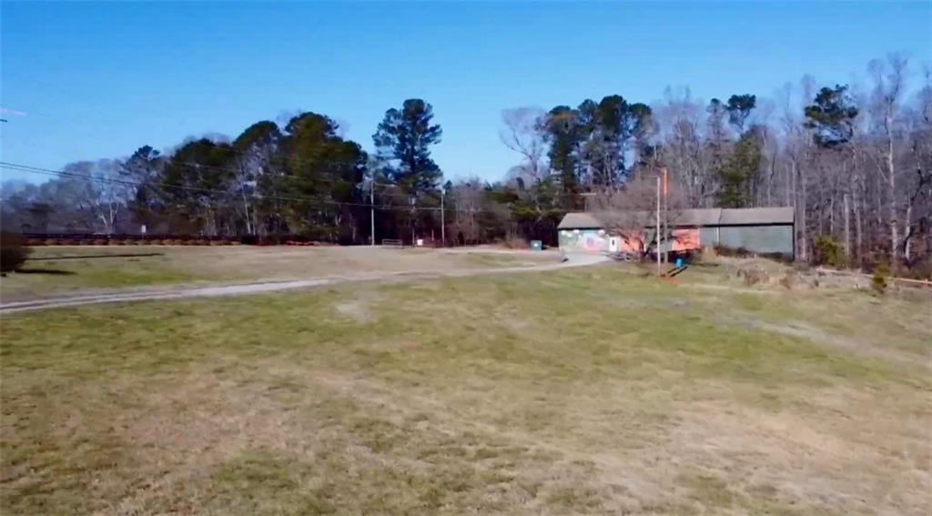 834 Arnold Mill Road Woodstock, GA 30188 - Photo 5 of 10 a view of a playground with a house and mountain view