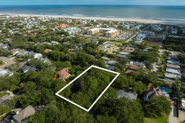 an aerial view of house with a yard