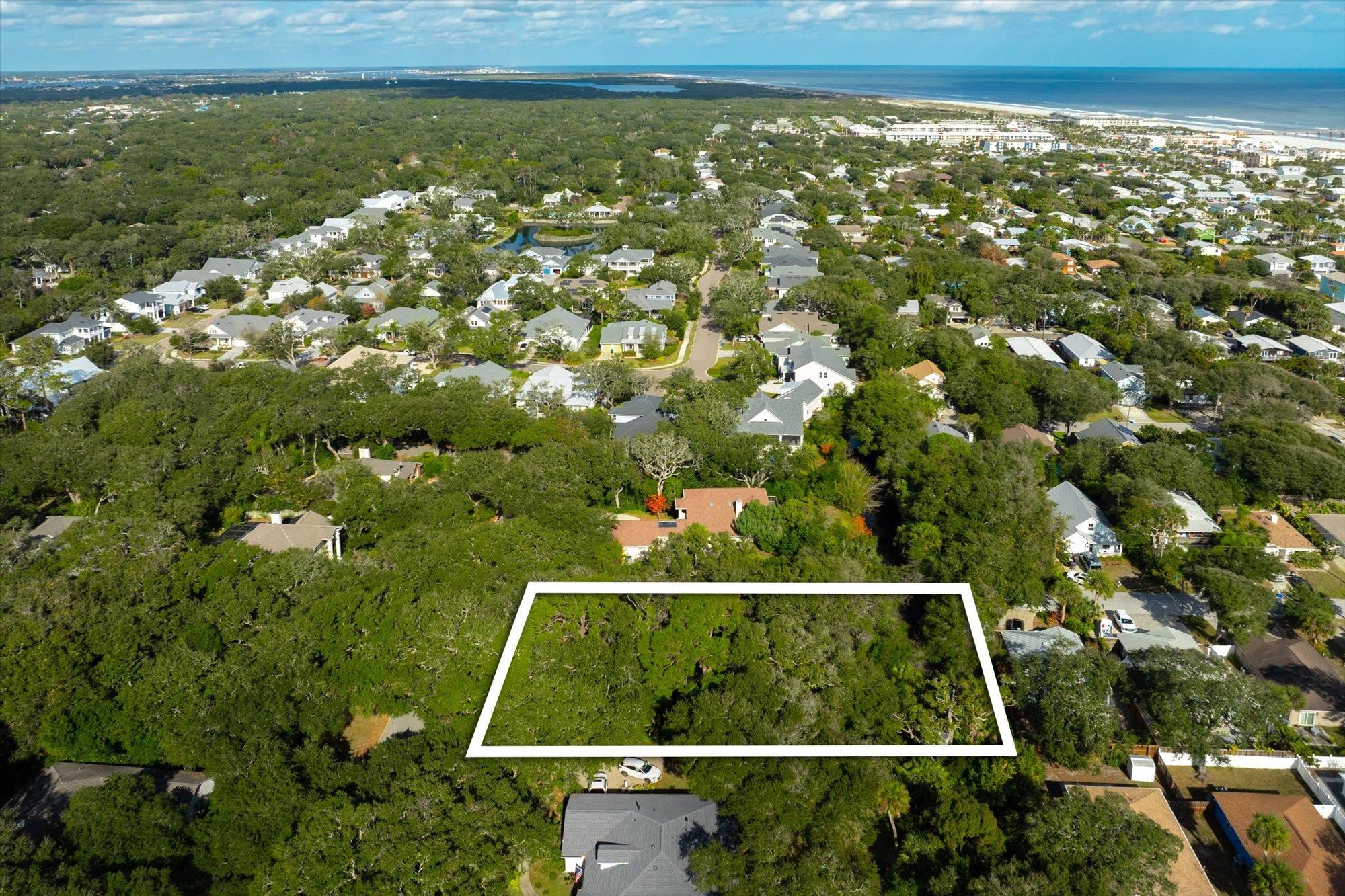 44 Ocean Pines Drive St. Augustine, FL 32080 - Photo 13 of 17 a view of a yard with a tree