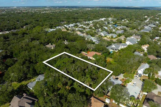 an aerial view of house with a yard