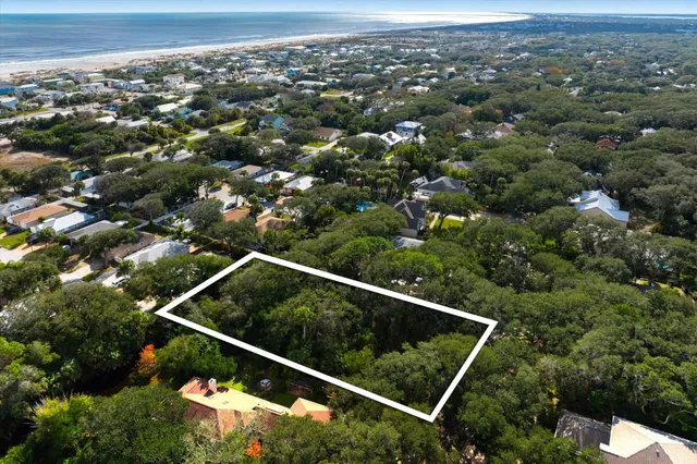 an aerial view of house with yard