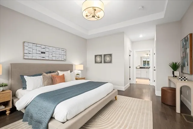 a bedroom with a bed and a table