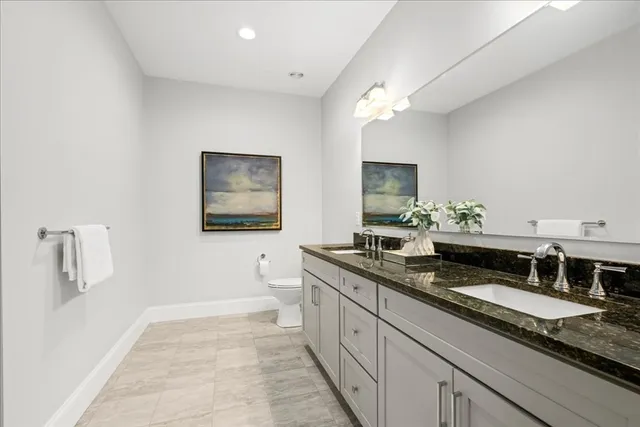 a bath room with a sink and a mirror