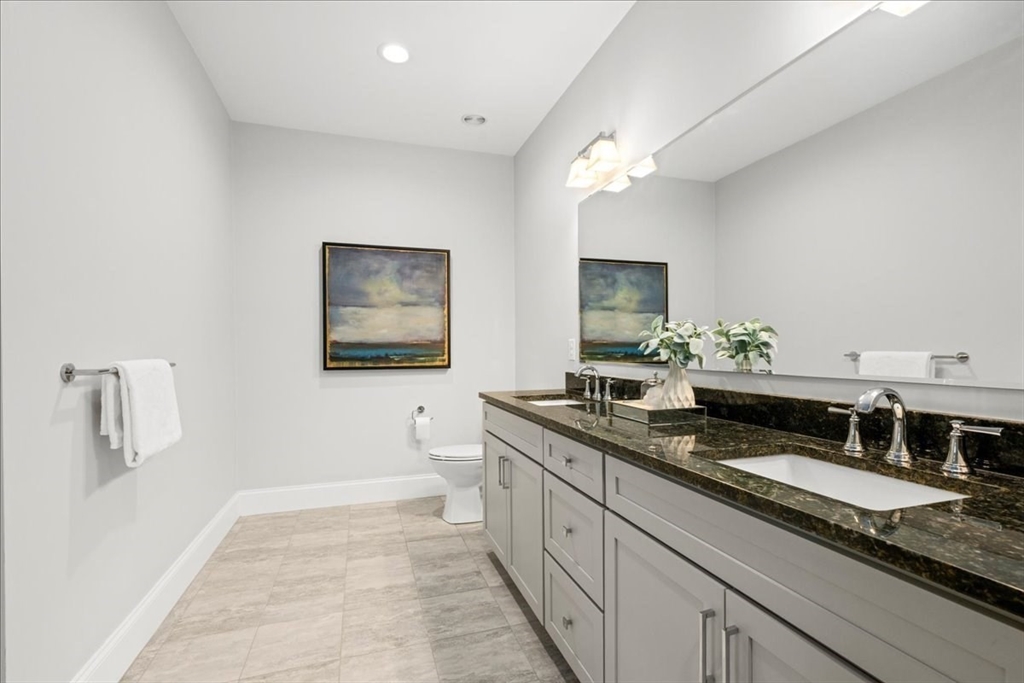 9 Hawk Lane, Unit 28 Framingham, MA 01701 - Photo 14 of 37 a bath room with a sink and a mirror