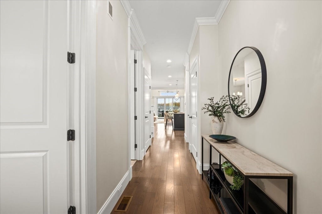 9 Hawk Lane, Unit 28 Framingham, MA 01701 - Photo 18 of 37 a view of a hallway with wooden floor