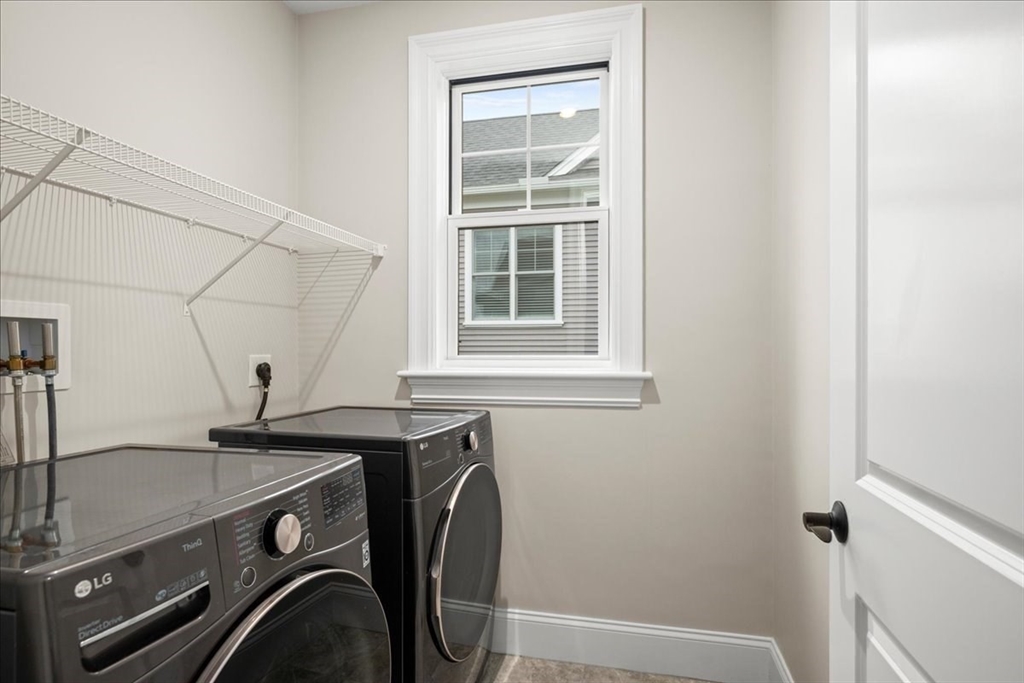9 Hawk Lane, Unit 28 Framingham, MA 01701 - Photo 20 of 37 a utility room with dryer and washer