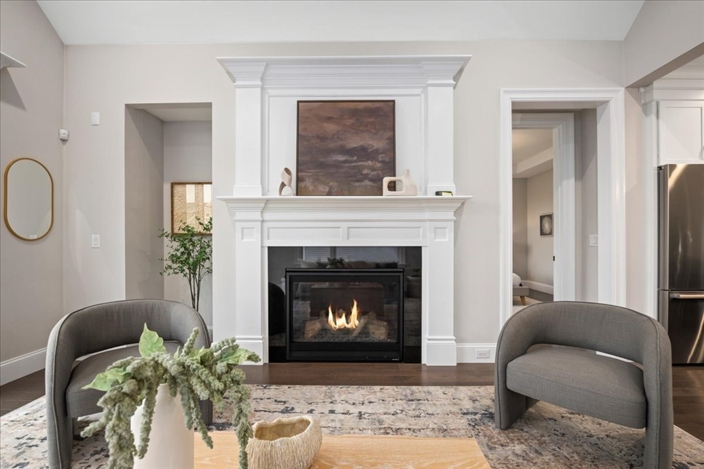 9 Hawk Lane, Unit 28 Framingham, MA 01701 - Photo 10 of 37 a living room with furniture and a fireplace