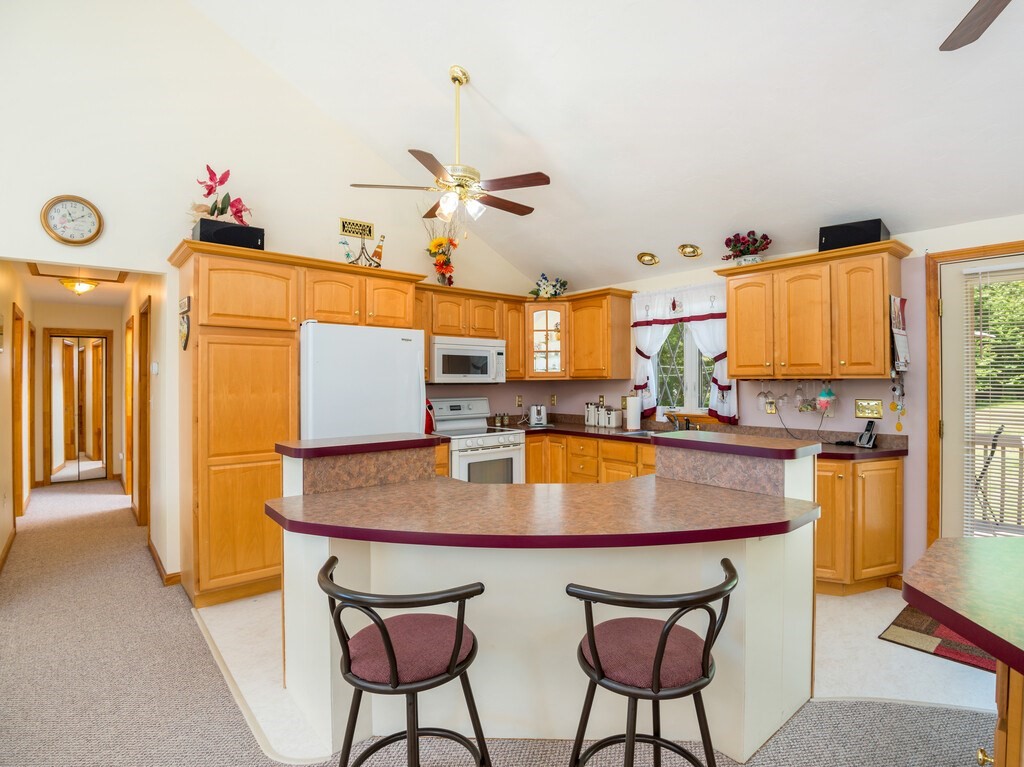 147 Pierpont Road Dudley, MA 01571 - Photo 23 of 42 a dining table with chairs and chandelier