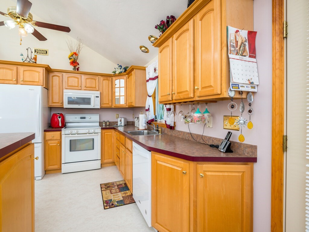 147 Pierpont Road Dudley, MA 01571 - Photo 25 of 42 a kitchen with stainless steel appliances granite countertop a sink a stove and cabinets