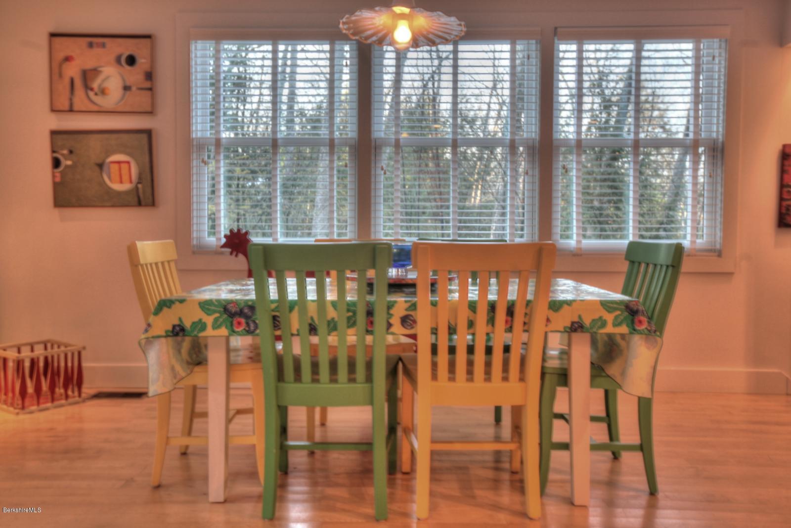 34 Bidwell Road Monterey, MA 01245 - Photo 12 of 37 a view of a dining room with furniture and wooden floor