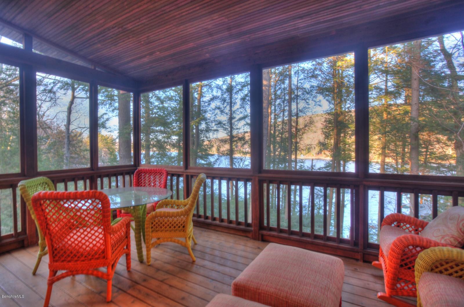 34 Bidwell Road Monterey, MA 01245 - Photo 17 of 37 a balcony with wooden floor outdoor seating and city view