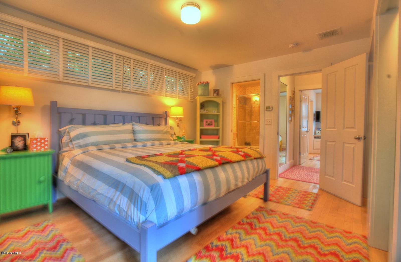 34 Bidwell Road Monterey, MA 01245 - Photo 21 of 37 a bedroom with a bed and walk in closet