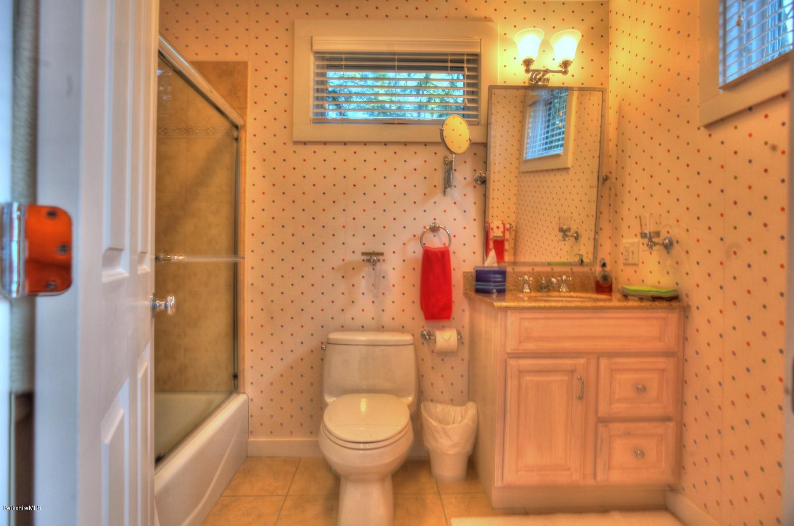 34 Bidwell Road Monterey, MA 01245 - Photo 23 of 37 a bathroom with a granite countertop sink toilet and shower