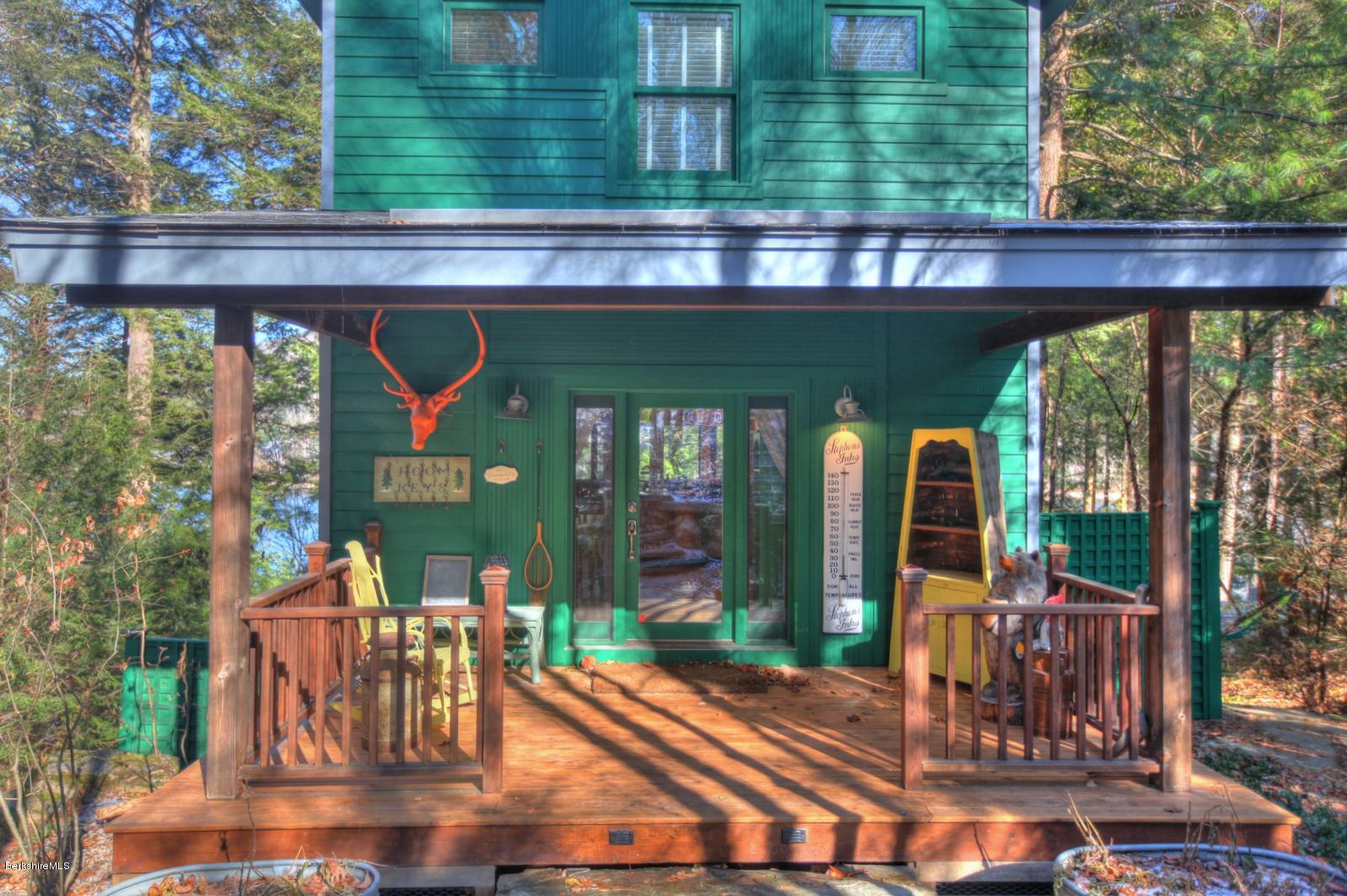 34 Bidwell Road Monterey, MA 01245 - Photo 10 of 37 a view of a porch with chairs and backyard