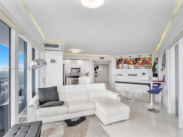 a living room with furniture and a couch