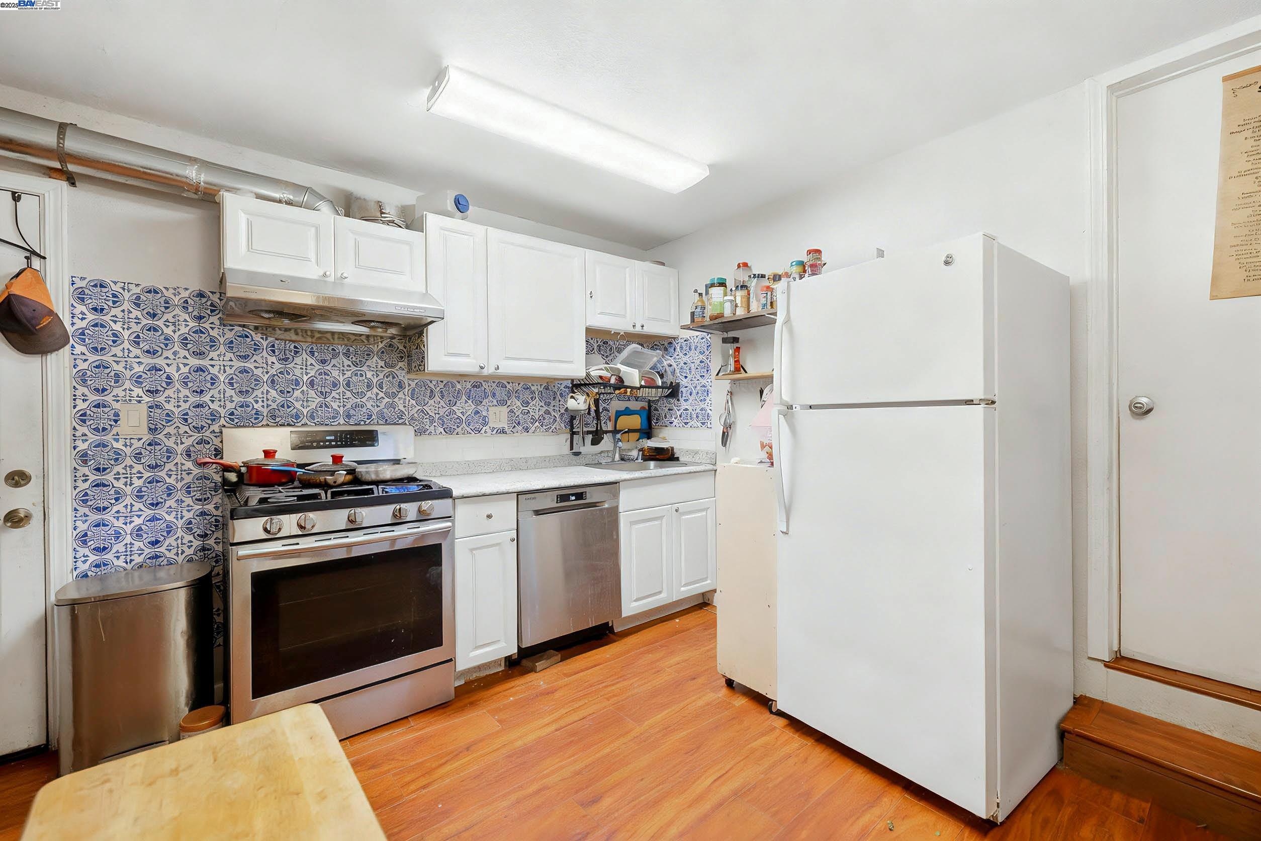 1040 Delacy Avenue Martinez, CA 94553 - Photo 24 of 52 a kitchen with a stove top oven and refrigerator