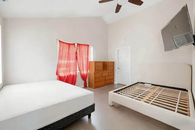 a bedroom with a bed and dresser