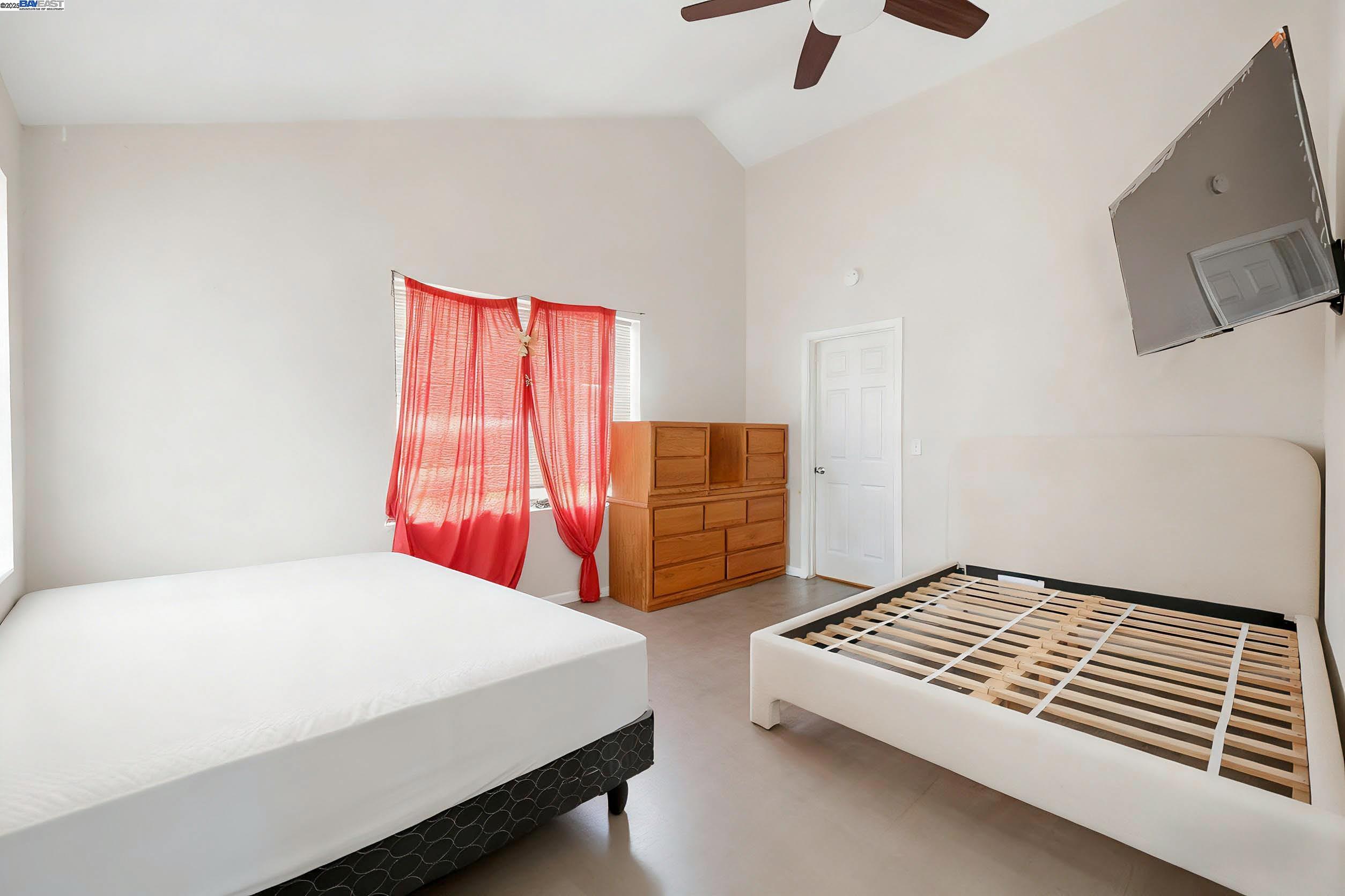 1040 Delacy Avenue Martinez, CA 94553 - Photo 28 of 52 a bedroom with a bed and dresser