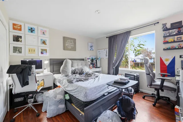 a bed room with a bed and a tv