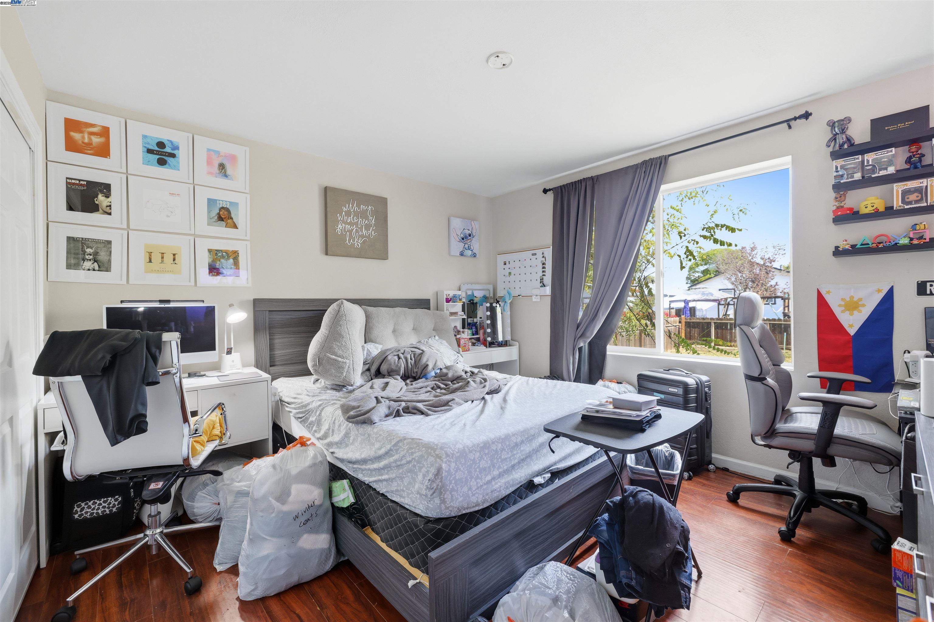 1040 Delacy Avenue Martinez, CA 94553 - Photo 42 of 52 a living room with furniture and a flat screen tv with bookshelf
