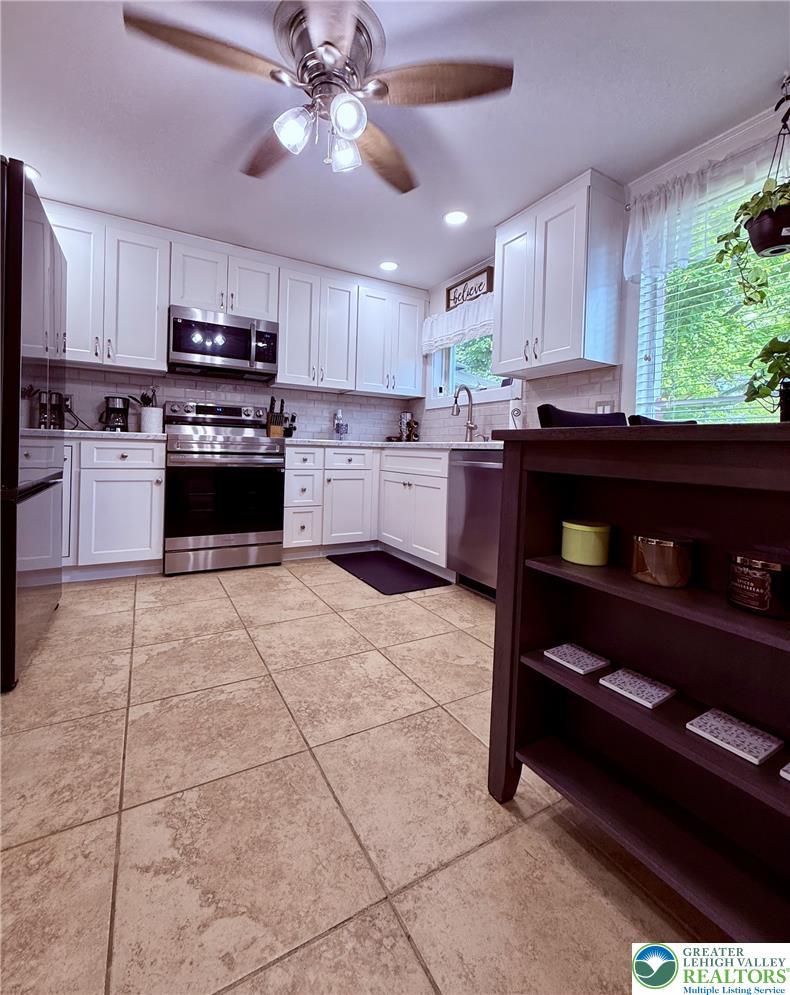 1275 Macada Road Bethlehem, PA 18017 - Photo 27 of 87 a kitchen with stainless steel appliances granite countertop a refrigerator and a stove top oven