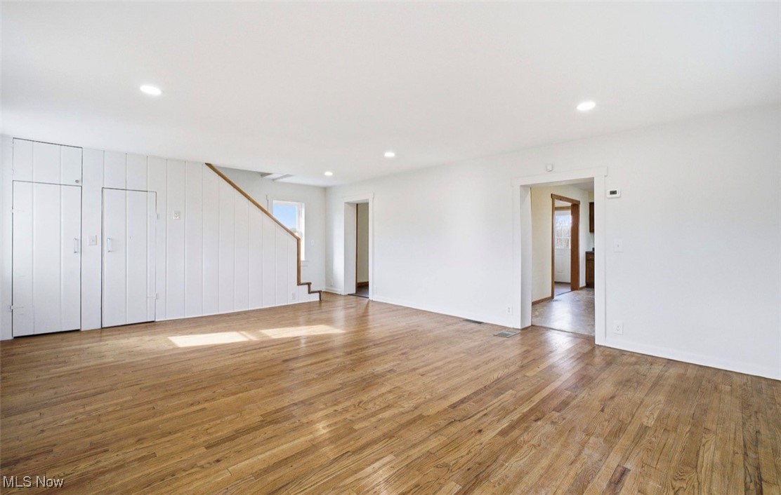 1635 Irish Ridge Road Philo, OH 43771 - Photo 7 of 48 Unfurnished living room featuring light wood-style floors, recessed lighting, and stairs