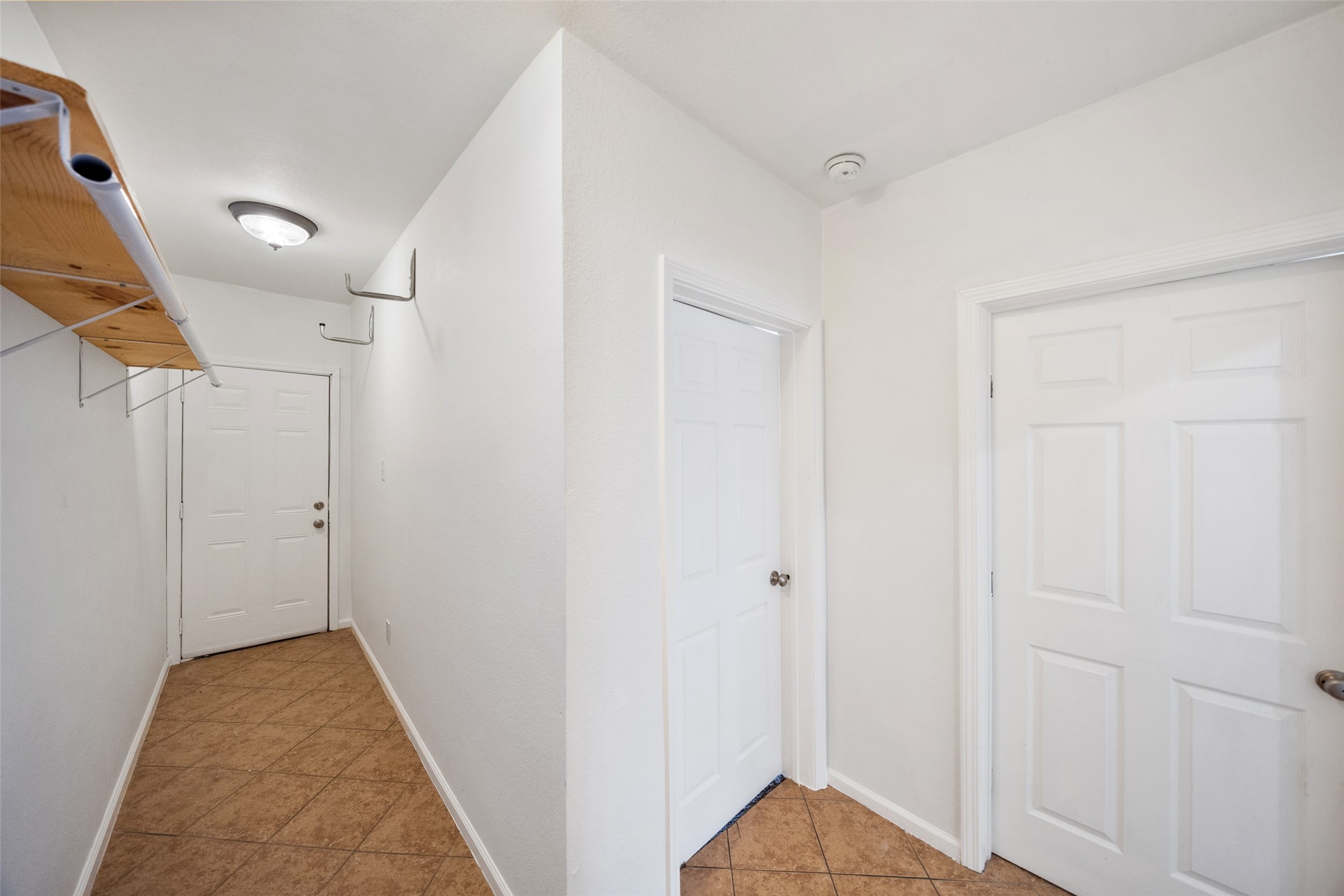 406 Quitman Street, Unit 2 Houston, TX 77009 - Photo 19 of 22 a view of a hallway with closet area
