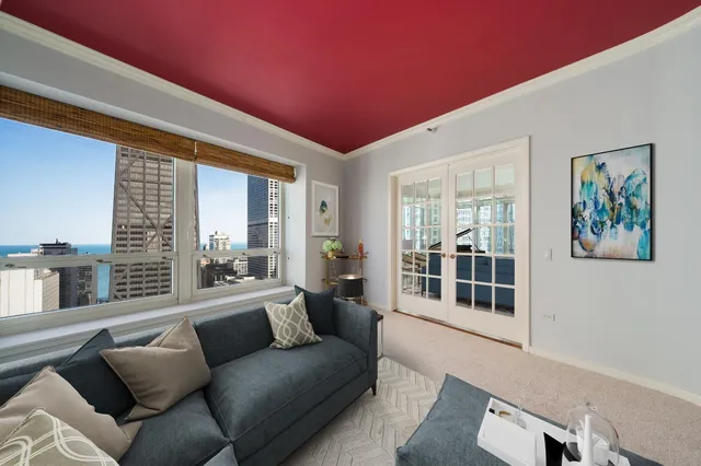 a living room with furniture and windows