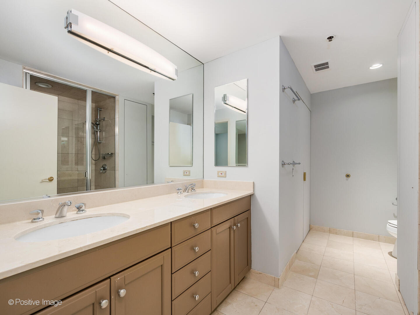57 East Delaware Place, Unit 3202 Chicago, IL 60611 - Photo 23 of 32 a spacious bathroom with a double vanity sink mirror and