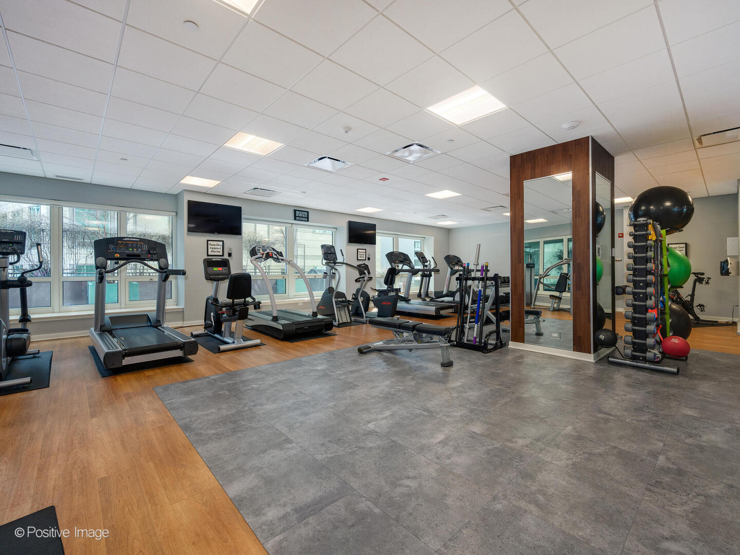 57 East Delaware Place, Unit 3202 Chicago, IL 60611 - Photo 29 of 32 a view of a room with gym equipment