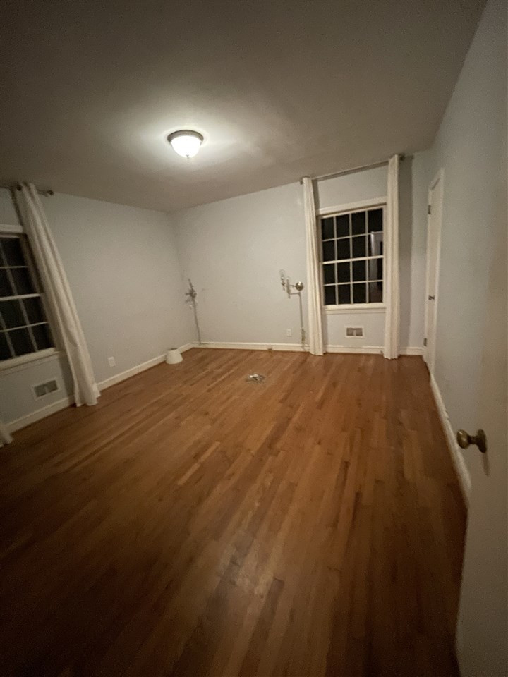2116 10th Avenue Raleigh, NC 27607 - Photo 4 of 5 a view of an empty room with a window