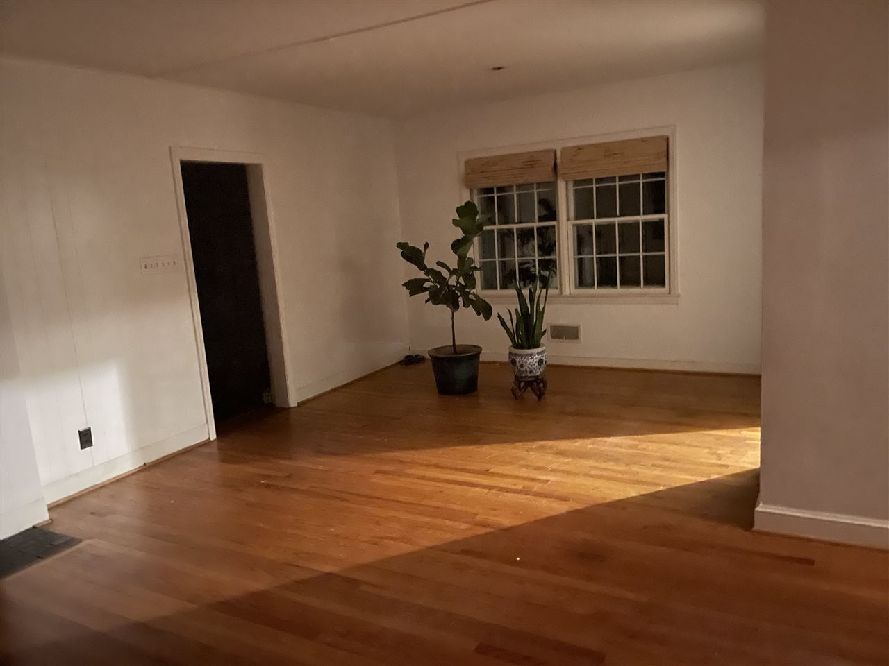 2116 10th Avenue Raleigh, NC 27607 - Photo 5 of 5 a view of a room with wooden floor and a window