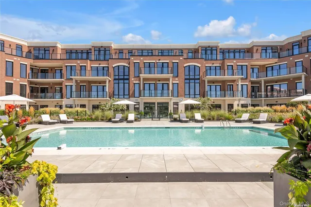 a front view of building with yard